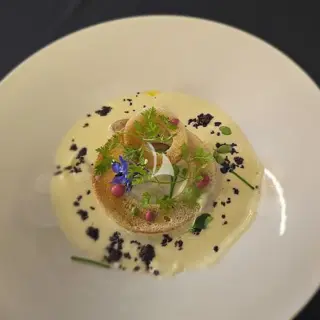 IMAGINE - Crispy brioche ring, borage flower & squid ink