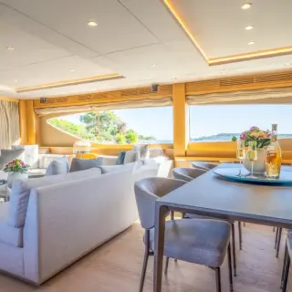 Dining table and sitting area in the saloon