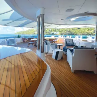 Multiple seating areas are available on the sun deck for those who wish to remain out from under cover or to recluse in shade from the sun.