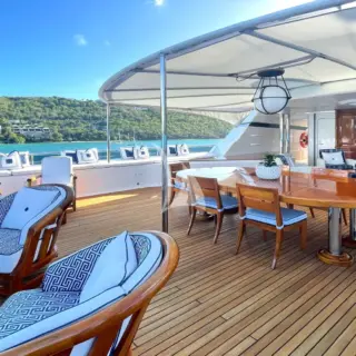 The expansive sun deck aft provides sheltered al fresco dining as well as comfortable arm chairs for causal lounging.