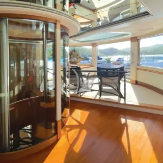 Unique to BLUE MOON is a bespoke glass elevator accessible to all four decks. This customization, along with others including flush thresholds between the interior and exterior decks, grant access to all varieties of mobility.
