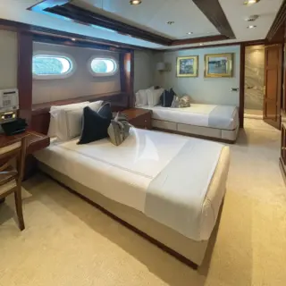 Perspective of the second convertible area on the lower deck guest quarters; flexible to Twins, or 1 King, or a lounge area.