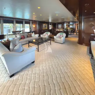 The main deck salon comes equipped with a retractable flatscreen HDTV and large windows for panoramic views.