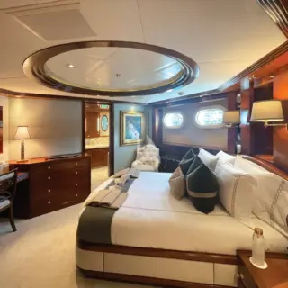 View of one of BLUE MOON's Queen staterooms, which can convert to an oversized VIP with the adjacent lounge.