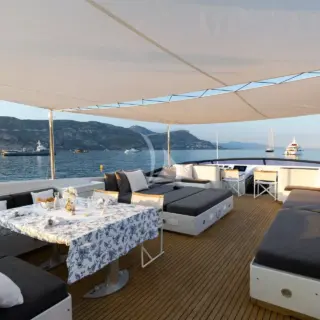Covered dining space on the flybridge