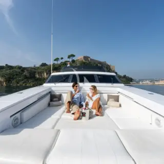 Guest relaxing on the foredeck sunbathing area