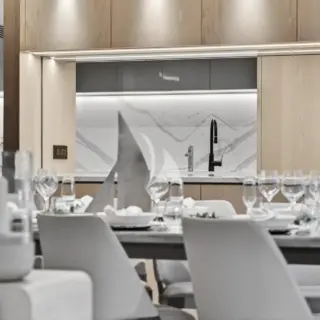 AURA - Main Salon Dining Featuring An Open Galley