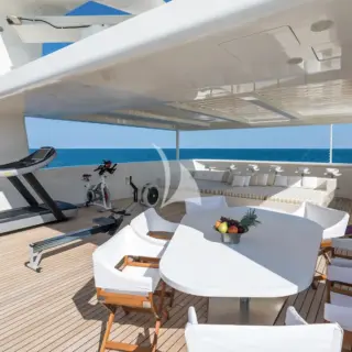 Sun deck  - With large sun pad, dining table and gym equipment