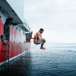 VIKINGFJORD - Guest jumping into the Arctic water