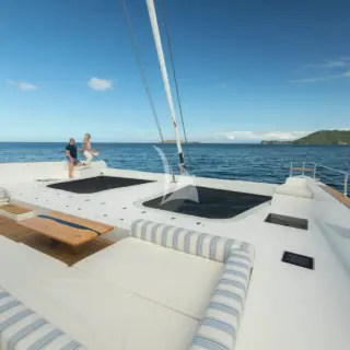 The expansive foredeck features a sunken lounge area