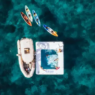 Inflatable pool, kayaks and tender