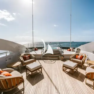 Sun deck jacuzzi, sitting area and sunpads