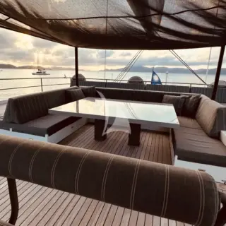 CHE - The open flybridge ideal for dining and lounging with shade options.