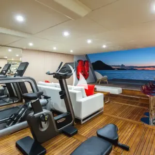 Beach club set up with gym, wet bar and seating area