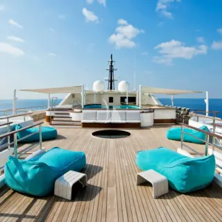 Expansive sundeck with 2-level pool and bar to relax in the sun
