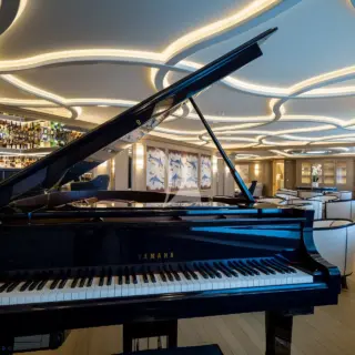 Two bars including one with card table and seating for 25 guests