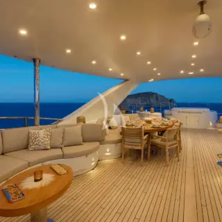 The exceptionally spacious unobstructed  sundeck has a Jacuzzi, a dining table, a bar & various spacious lounges & sunbathing areas