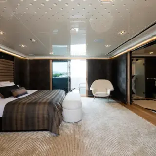 Master stateroom with sliding windows to balconies